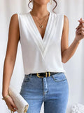 Lightweight & flattering women’s blouse – sleeveless pleated design, high-quality fabric, for elegant occasions